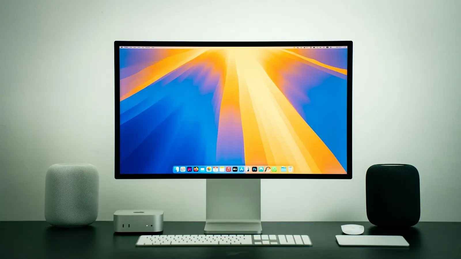 Mac and Studio Display on a desk in a bright room
